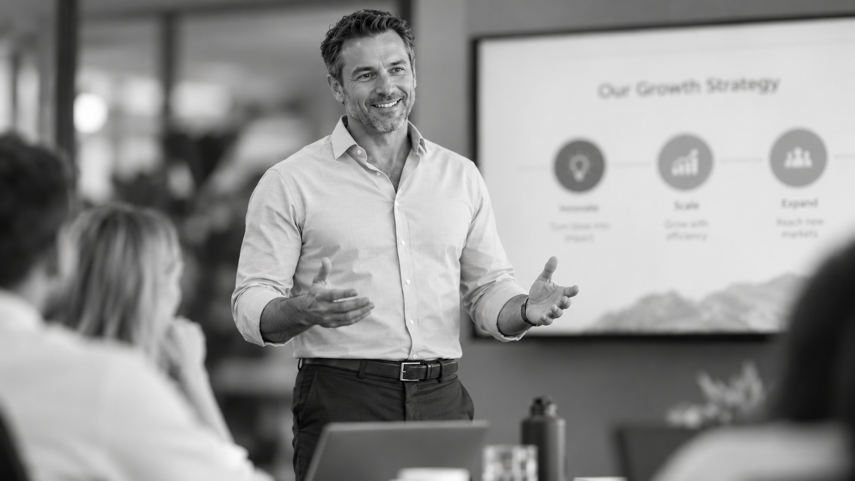 Man confidently presenting in a meeting, reflecting the energy to stay active and engaged while managing weight loss.